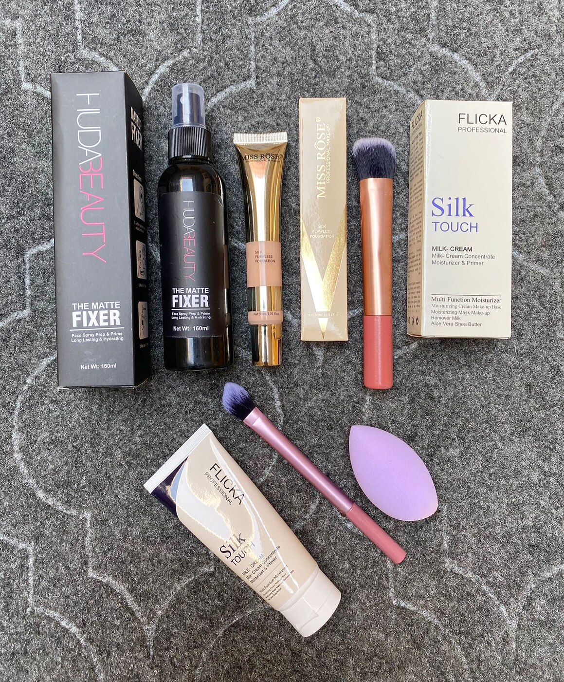 MK Signature Skin Prep Duo with fixer spray, foundation, primer and brush